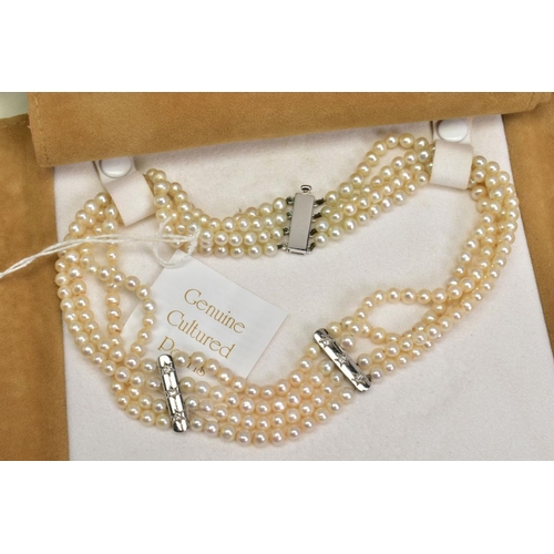 97 - A FOUR ROW CULTURED PEARL CHOKER NECKLACE WITH DIAMONDS, designed as four rows of spherical cultured... 