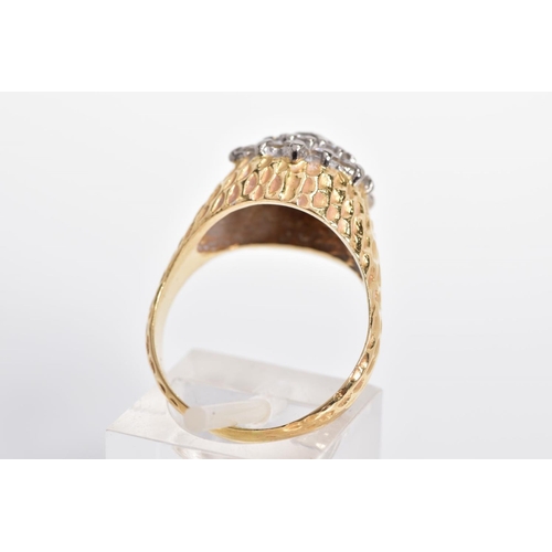 10 - A DIAMOND DRESS RING, designed as a three tiered cluster of brilliant cut diamonds to the textured t... 