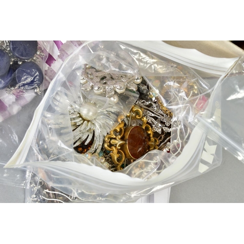 100 - A BOX OF COSTUME JEWELLERY, to include various brooches of floral design, necklaces, bracelets, pend... 