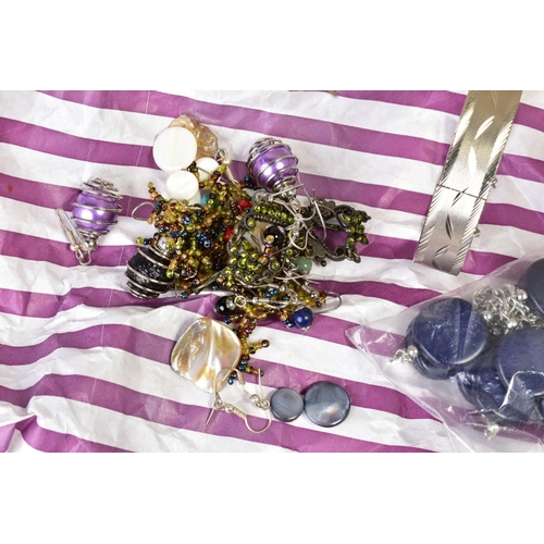 100 - A BOX OF COSTUME JEWELLERY, to include various brooches of floral design, necklaces, bracelets, pend... 