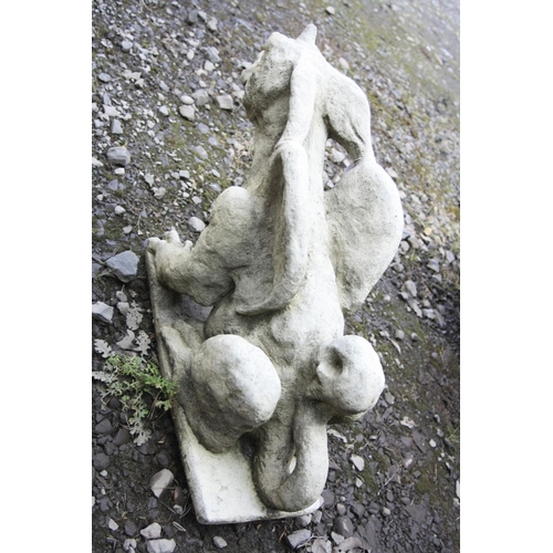 1005 - A COMPOSITE GARDEN FIGURE IN THE FORM OF A MYTHICAL WINGED CREATURE, length 66cm