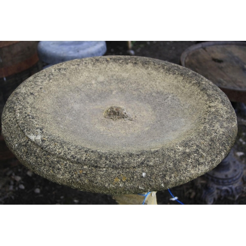 1012 - A COMPOSITE TWO PIECE BIRD BATH with a stepped and detailed base, square baluster tapering stem and ... 