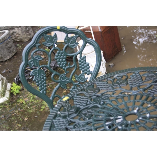 1027 - A GREEN CAST ALUMINIUM CIRCULAR GARDEN TABLE, diameter 65cm a pair of matching chairs (sd) and a set... 