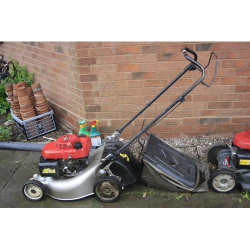 1029 - A HONDA GCV 160 PETROL LAWN MOWER and grass bag