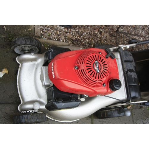 1029 - A HONDA GCV 160 PETROL LAWN MOWER and grass bag