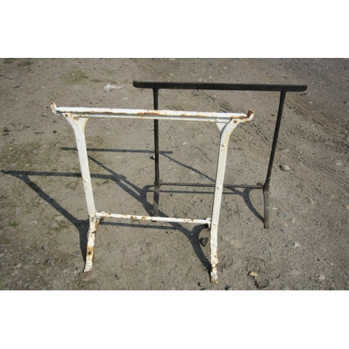 1032 - TWO VINTAGE CAST IRON TRESTLES of two different designs, 78cm and 79cm wide x both 72cm high