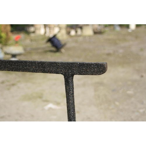 1032 - TWO VINTAGE CAST IRON TRESTLES of two different designs, 78cm and 79cm wide x both 72cm high