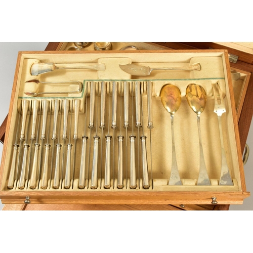 110 - A SECOND HALF 20TH CENTURY WALNUT AND OAK CASED CONTINENTAL WHITE METAL CANTEEN OF CUTLERY FOR TWELV... 