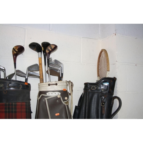 1107 - SIX GOLF BAGS including clubs of various makers and a vintage tennis racket