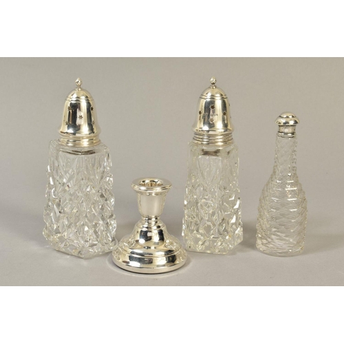 112 - A NEAR PAIR OF ELIZABETH II SILVER TOPPED GLASS SUGAR CASTERS, London 1969 and 1972, together with a... 