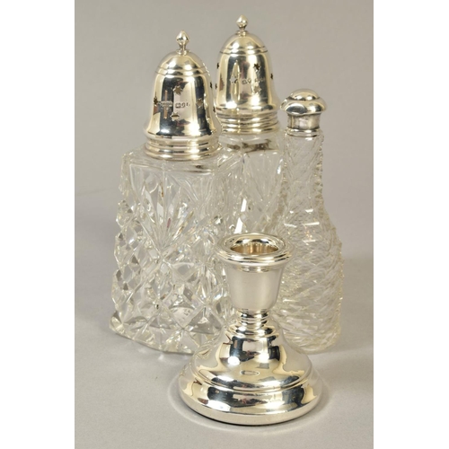 112 - A NEAR PAIR OF ELIZABETH II SILVER TOPPED GLASS SUGAR CASTERS, London 1969 and 1972, together with a... 