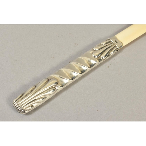 116 - A LATE VICTORIAN SILVER HANDLED IVORY PAGE TURNER, embossed spiral and leaf design, maker Henry Char... 