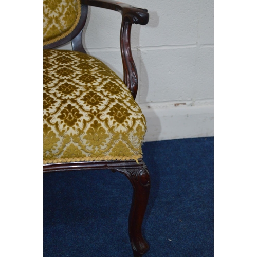 1202 - A VICTORIAN MAHOGANY FOLIATE UPHOLSTERED TWO SEATER SERPENTINE FRONTED SETTEE, flanked with two back... 