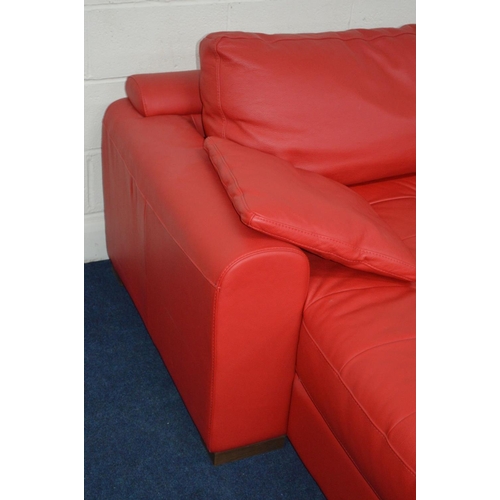 1211 - A BRIGHT RED LEATHER LA METEORA CORNER SOFA on wooden block legs together with two cushions, length ... 