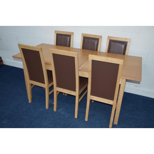 1215 - A RECTANGULAR EXTENDING BEECH DINING TABLE with six matching leatherette chairs (7)