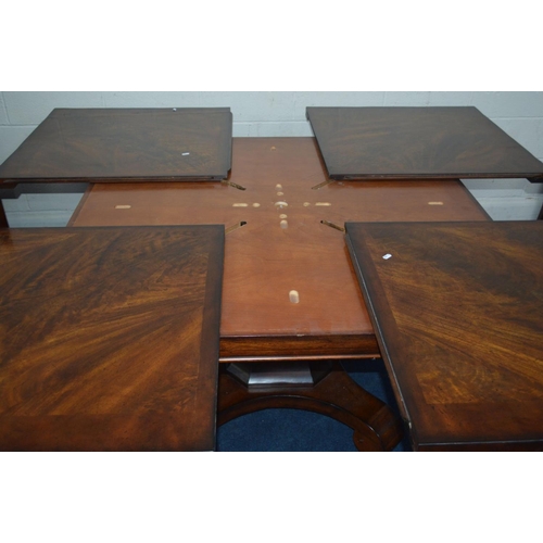 1216 - A SQUARE REPRODUCTION FLAME MAHOGANY AND MAHOGANY BANDED FINISH EXTENDING DINING TABLE, extending at... 