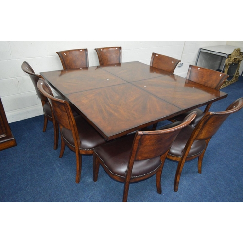 1216 - A SQUARE REPRODUCTION FLAME MAHOGANY AND MAHOGANY BANDED FINISH EXTENDING DINING TABLE, extending at... 