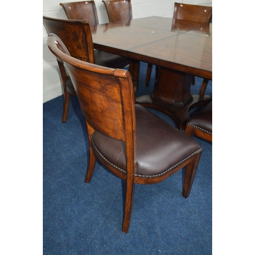 1216 - A SQUARE REPRODUCTION FLAME MAHOGANY AND MAHOGANY BANDED FINISH EXTENDING DINING TABLE, extending at... 