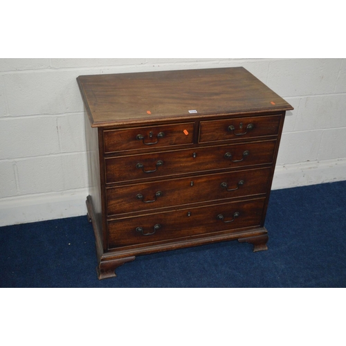 1218 - A GEORGE III MAHOGANY CHEST of two short and three long graduating drawers, swan neck handles, brass... 