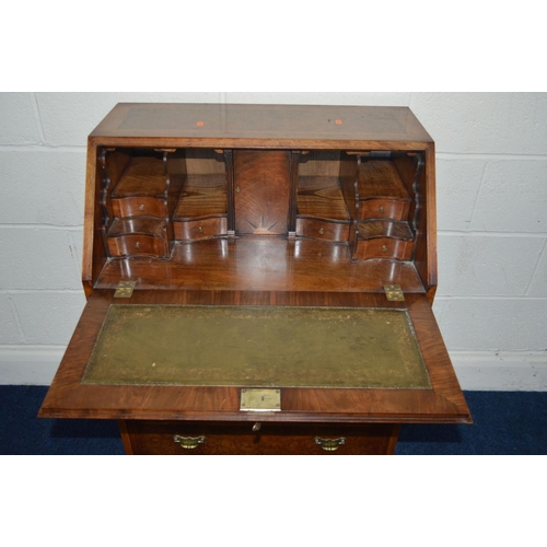 1219 - A REPRODUCTION LADIES BURR WALNUT BUREAU with two short and three long graduating drawers, inside a ... 