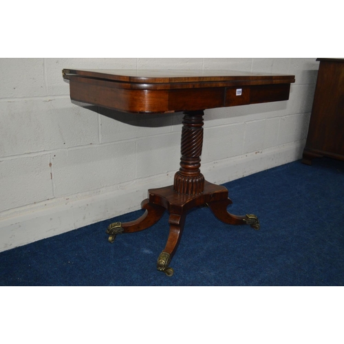 1220 - A REGENCY MAHOGANY TEA TABLE, with cross banding detail to top, central support in the form of barle... 