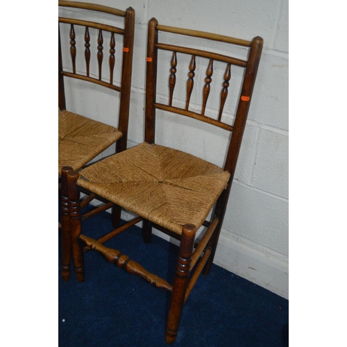 1226 - A SET OF THREE EARLY 19TH CENTURY FRUITWOOD RUSH SEATED CHAIRS with turned spindled backs together w... 