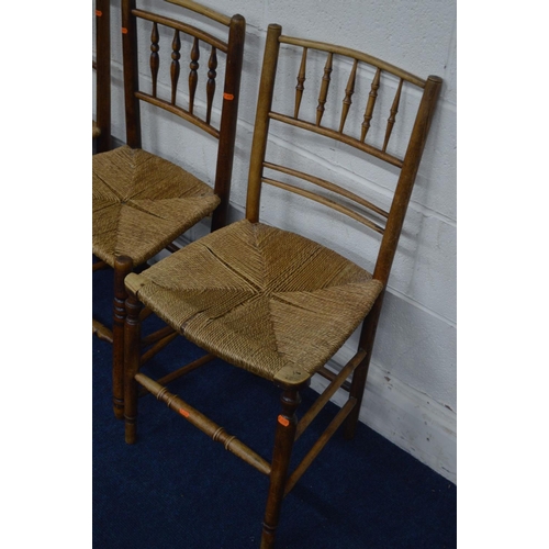 1226 - A SET OF THREE EARLY 19TH CENTURY FRUITWOOD RUSH SEATED CHAIRS with turned spindled backs together w... 