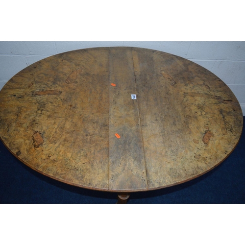 1227 - A LATE 19TH CENTURY BURR WALNUT OVAL TOPPED SUTHERLAND TABLE on twin fluted legs and turned stretche... 