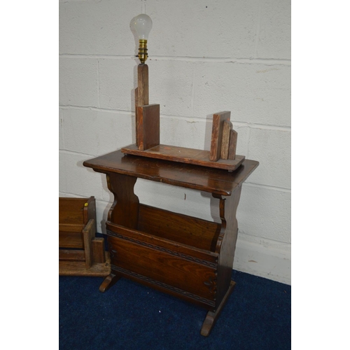 1233 - A REPRODUCTION OAK MAGAZINE RACK together with an oak bookstand with a lamp attachment and two other... 