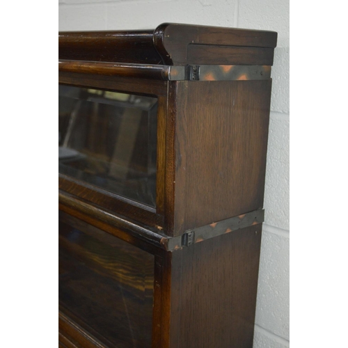 1242 - AN OAK FOUR SECTIONAL BOOKCASE, the Globe-Wernicke Co Limited, London, with glazed flap front sectio... 