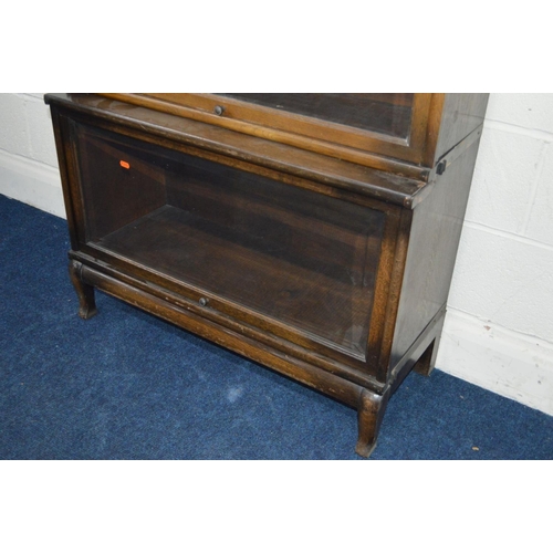 1242 - AN OAK FOUR SECTIONAL BOOKCASE, the Globe-Wernicke Co Limited, London, with glazed flap front sectio... 