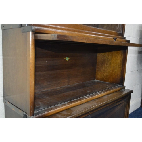 1242 - AN OAK FOUR SECTIONAL BOOKCASE, the Globe-Wernicke Co Limited, London, with glazed flap front sectio... 