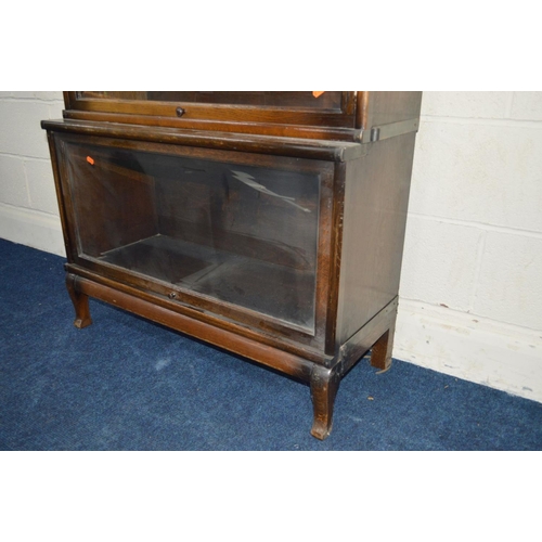 1243 - AN OAK FOUR SECTIONAL BOOKCASE, the Globe-Wernicke Co Limited, London, with glazed flap front sectio... 