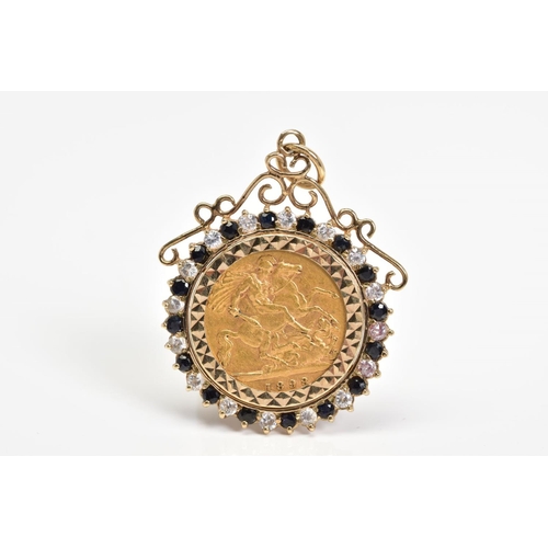 13 - A HALF SOVEREIGN PENDANT, the Victoria 1898 half sovereign within a sapphire and colourless paste su... 