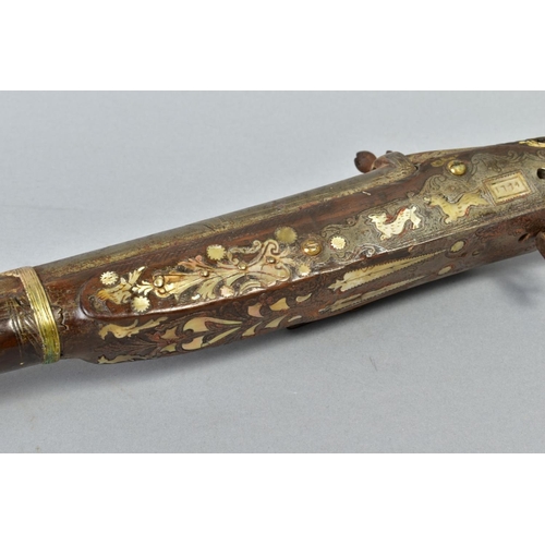 142 - AN ANTIQUE ARAB FLINTLOCK MUZZLE LOADING MUSKET, with decorative bone and mother of pearl inlays to ... 