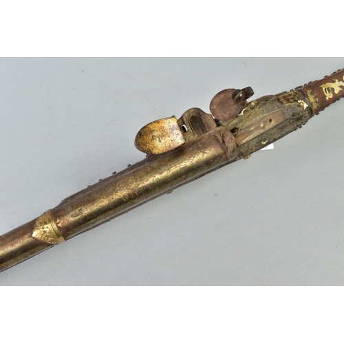 142 - AN ANTIQUE ARAB FLINTLOCK MUZZLE LOADING MUSKET, with decorative bone and mother of pearl inlays to ... 