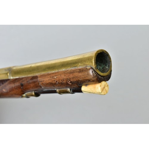 147 - A 21 BORE BRASS BARREL FLINTLOCK HOLSTER PISTOL dating from the late 1700's, it's 8'' brass barrel i... 