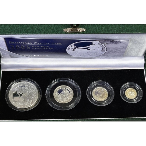 154 - A CARDBOARD BOX CONTAINING UK ROYAL MINT COIN PROOF SETS to include two three cased one pound silver... 