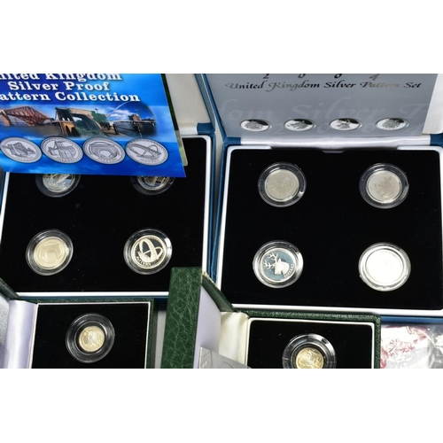 154 - A CARDBOARD BOX CONTAINING UK ROYAL MINT COIN PROOF SETS to include two three cased one pound silver... 