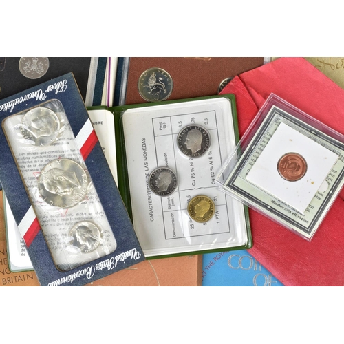 155 - A BOX OF COINS, COMMEMORATIVES, YEAR SETS to include a silver Lion of England five pound coin, Canad... 