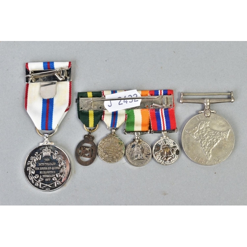 161 - A SMALL NUMBER OF MILITARY MEDALS as follows, four miniature medals on a bar, WWII war medal, India ... 