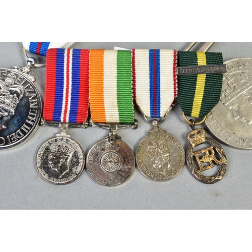 161 - A SMALL NUMBER OF MILITARY MEDALS as follows, four miniature medals on a bar, WWII war medal, India ... 