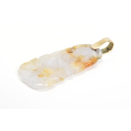 17 - A CARVED JADE PENDANT, carved with floral detail, with attached suspension loop, length 49mm, approx... 