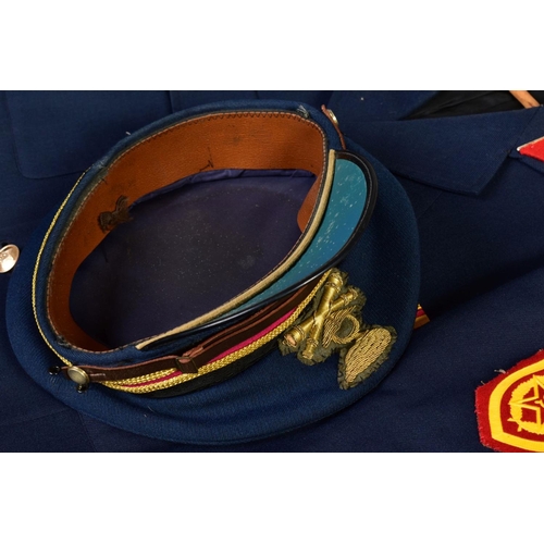 171 - A RUSSIAN BELIEVED POST WWII MILITARY UNIFORM, complete with jacket, trousers and peaked visor cap, ... 