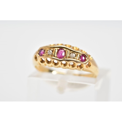 22 - AN EARLY 20TH CENTURY 18CT GOLD RUBY AND DIAMOND RING, the boat shaped top panel set with a line of ... 