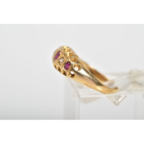 22 - AN EARLY 20TH CENTURY 18CT GOLD RUBY AND DIAMOND RING, the boat shaped top panel set with a line of ... 