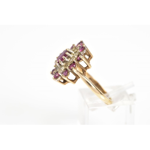 27 - A 9CT GOLD GARNET AND DIAMOND CLUSTER RING, designed as a central oval garnet within a single cut di... 