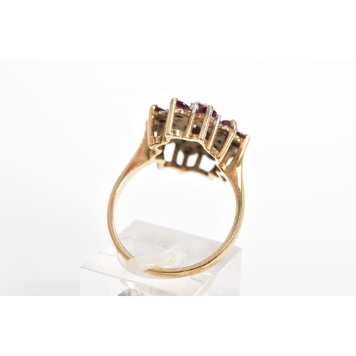 27 - A 9CT GOLD GARNET AND DIAMOND CLUSTER RING, designed as a central oval garnet within a single cut di... 