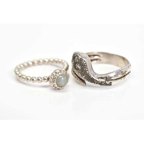 32 - A PANDORA RING AND A SNAKE RING, the Pandora ring designed with a circular rock crystal cabochon wit... 