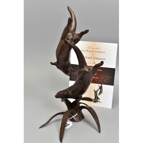 330 - MICHAEL SIMPSON (BRITISH CONTEMPORARY) 'OUT TO PLAY', a bronze sculpture of otters at play above fol... 